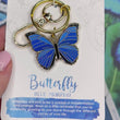 Load and play video in Gallery viewer, Blue Morpho Butterfly Enamel Keychain