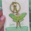 Load and play video in Gallery viewer, Luna Moth Enamel Keychain