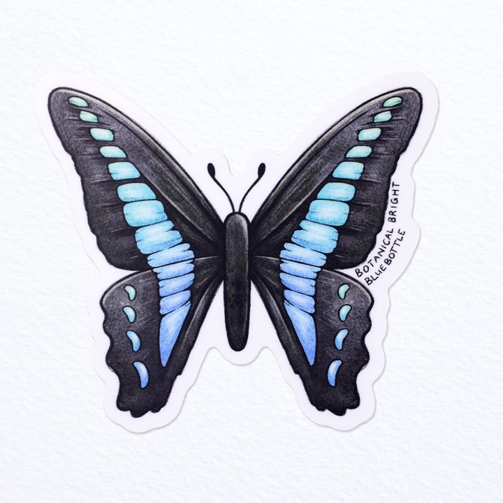 https://botanicalbright.com/cdn/shop/files/Botanical-Bright-Bluebottle-Butterfly-Waterproof-Vinyl-Sticker-1_720x.jpg?v=1683846635